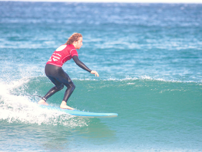 ASI Surf Wise Level 3 Beginner Surfer trimming on a wave
